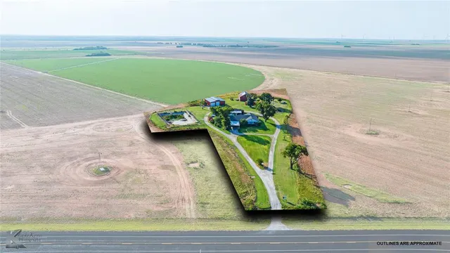 a view of a floor to ceiling window and a yard