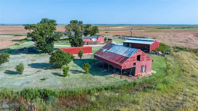 an aerial view of a house with outdoor space