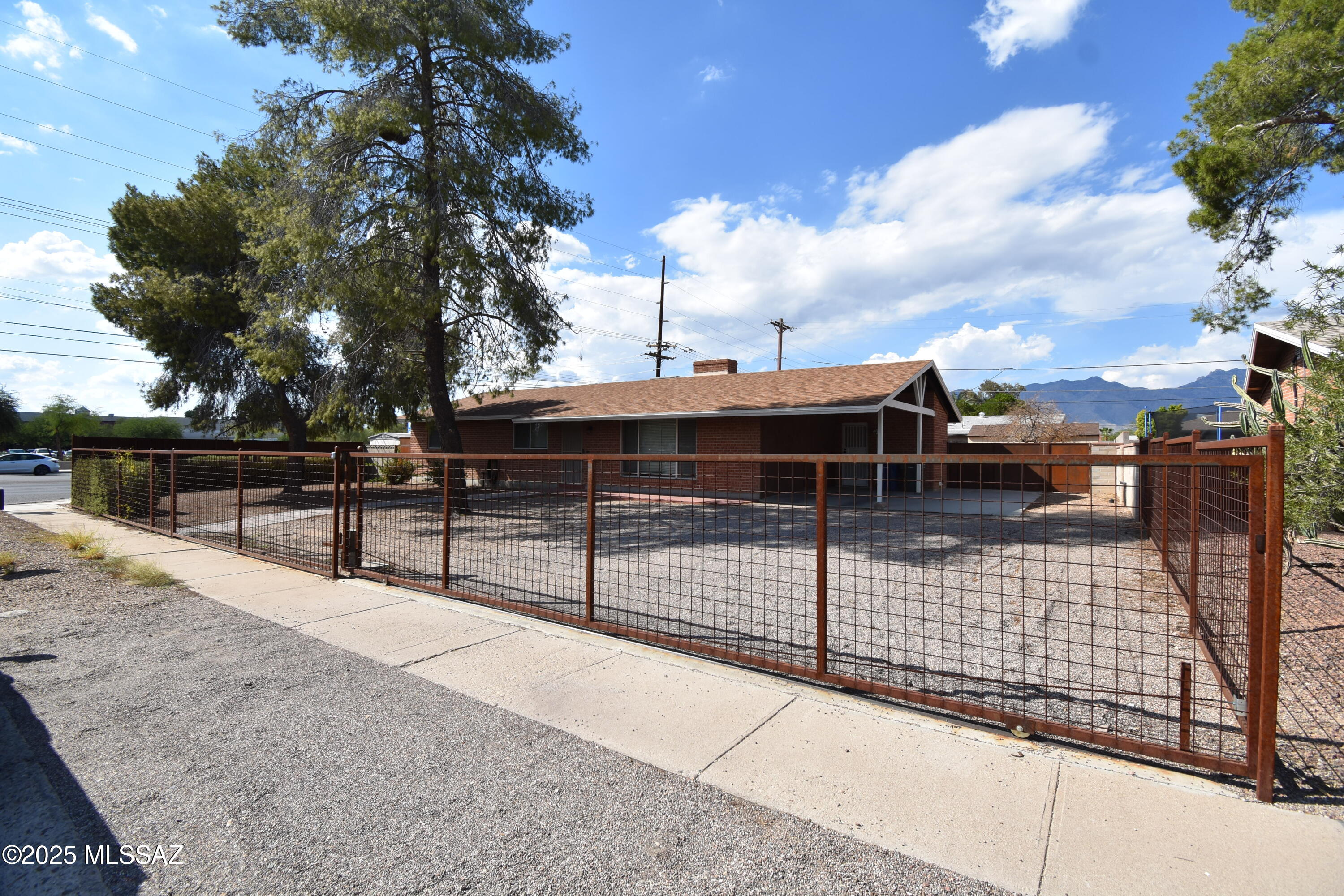 5501 East Spring Street Tucson, AZ 85712 - Photo 1 of 32 a view of a terrace with trees