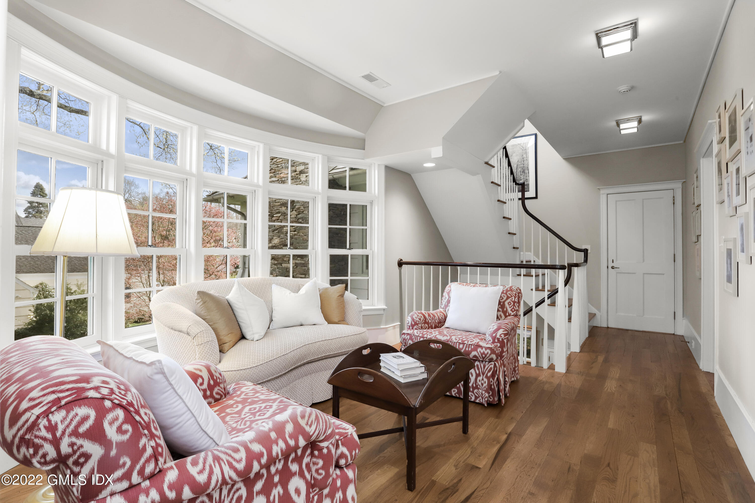 22 Glen Road Greenwich, CT 06830 - Photo 18 of 30 a bedroom with furniture and wooden floor