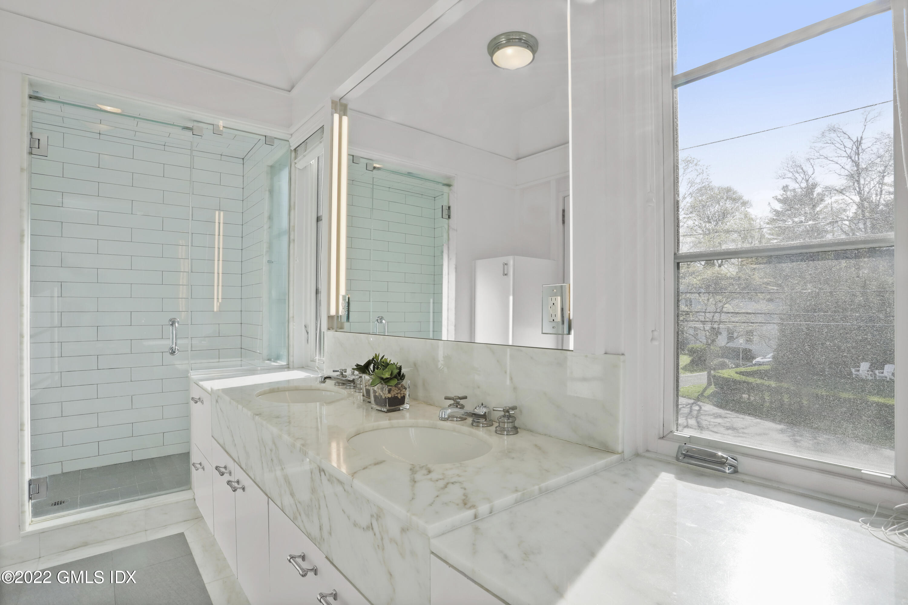 22 Glen Road Greenwich, CT 06830 - Photo 20 of 30 a bathroom with a granite countertop sink and a mirror