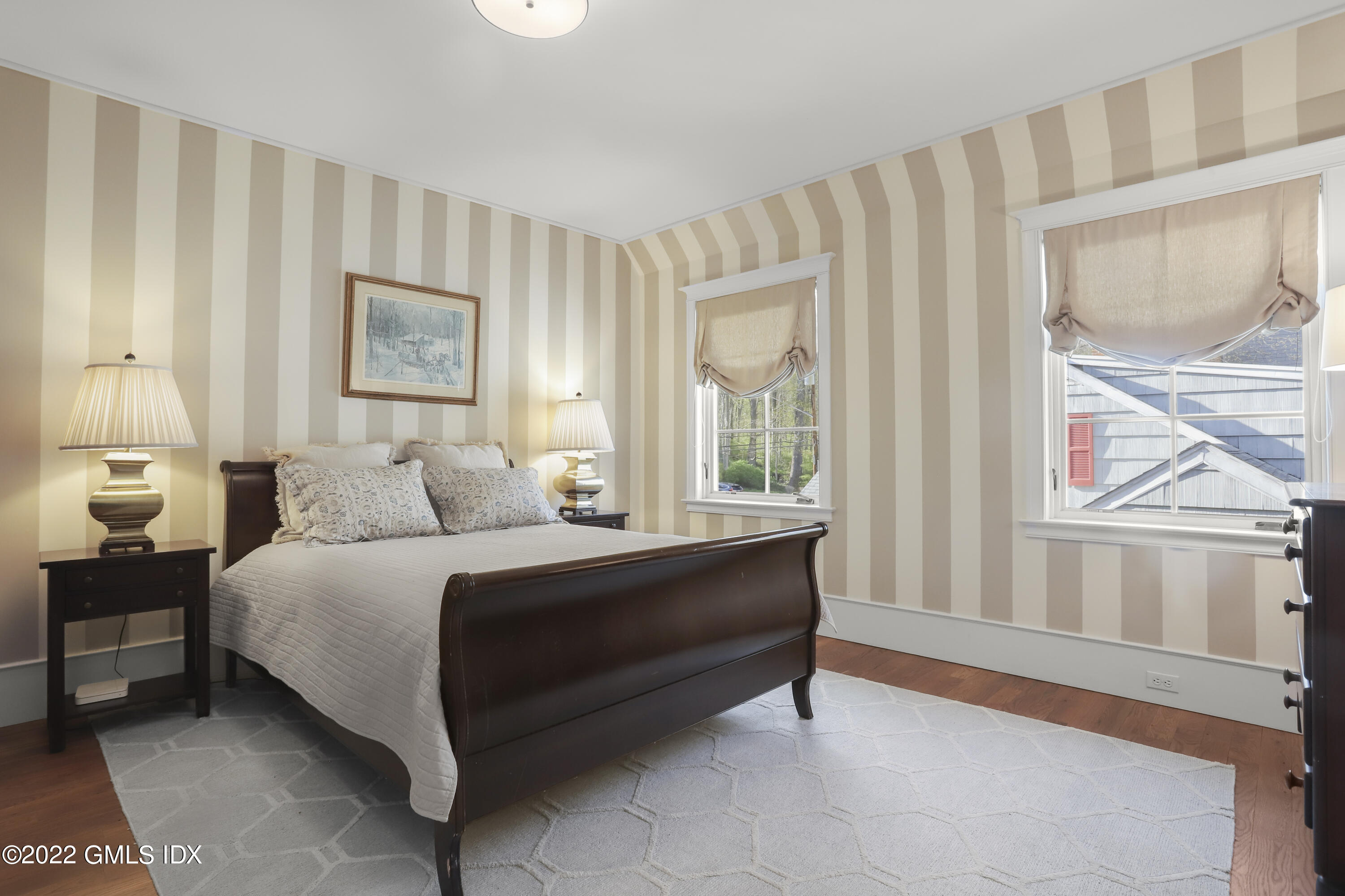 22 Glen Road Greenwich, CT 06830 - Photo 22 of 30 a spacious bedroom with a bed and a window