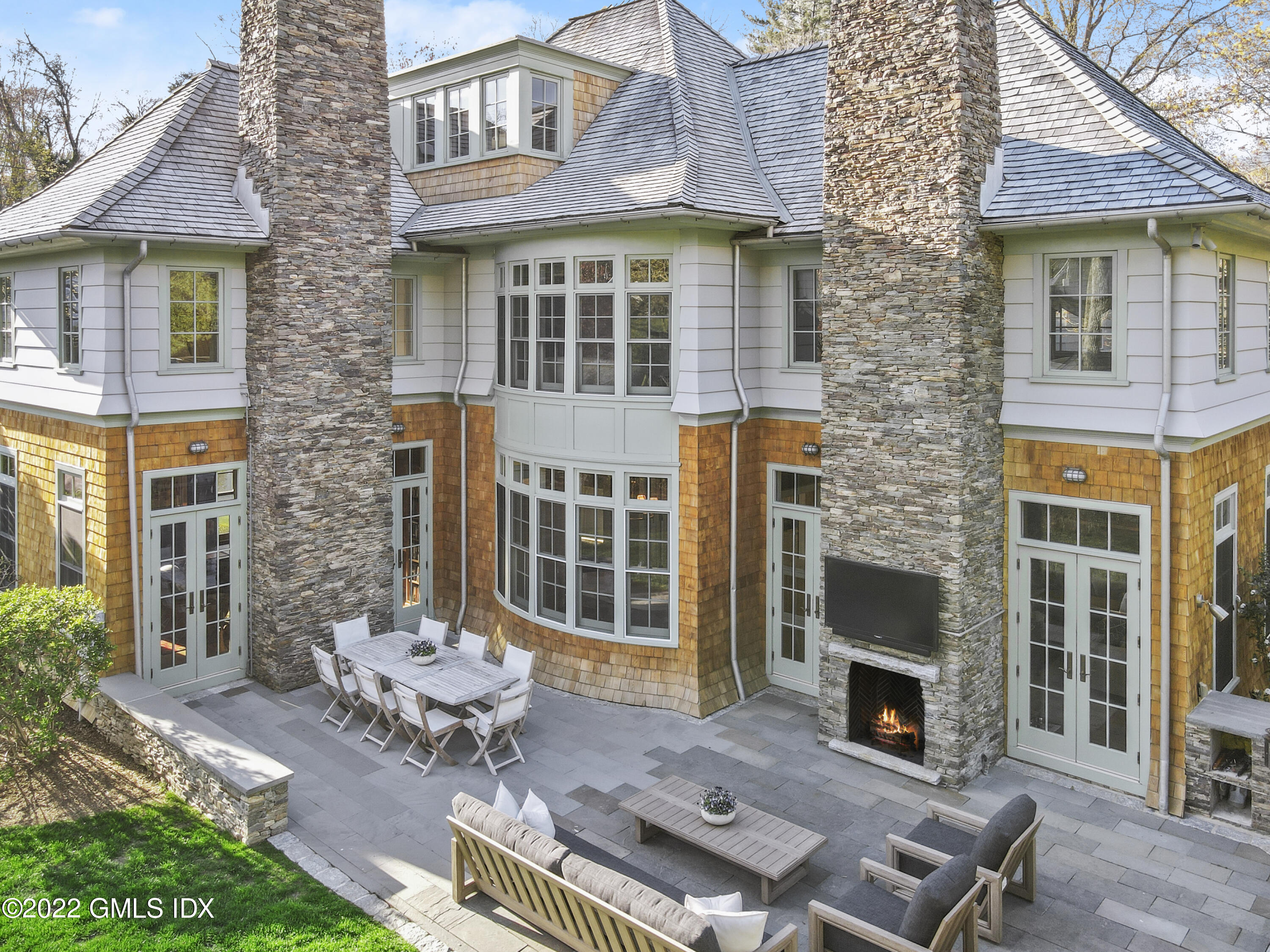 22 Glen Road Greenwich, CT 06830 - Photo 3 of 30 a backyard of a house with outdoor seating