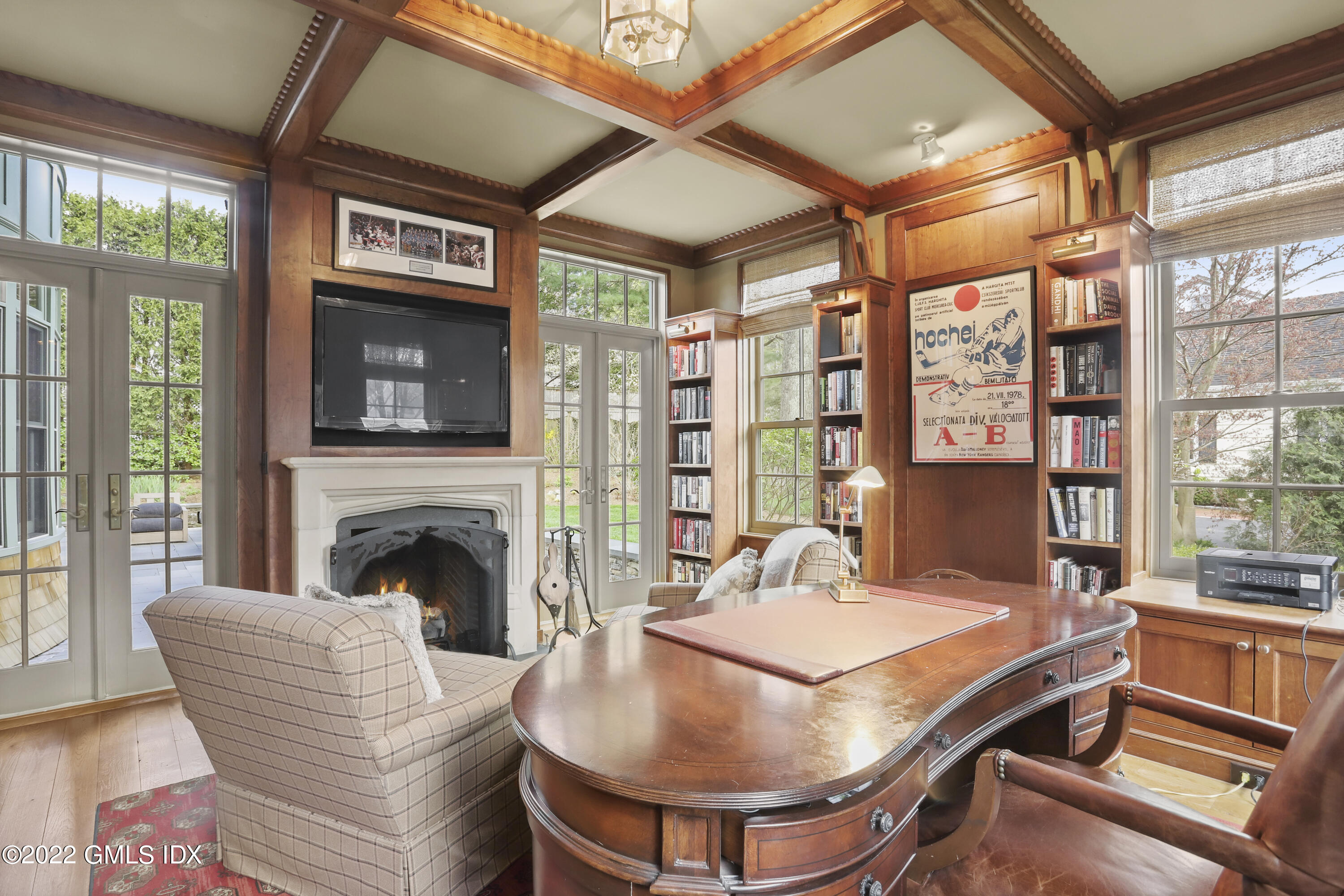 22 Glen Road Greenwich, CT 06830 - Photo 9 of 30 a living room with furniture a fireplace and a large window