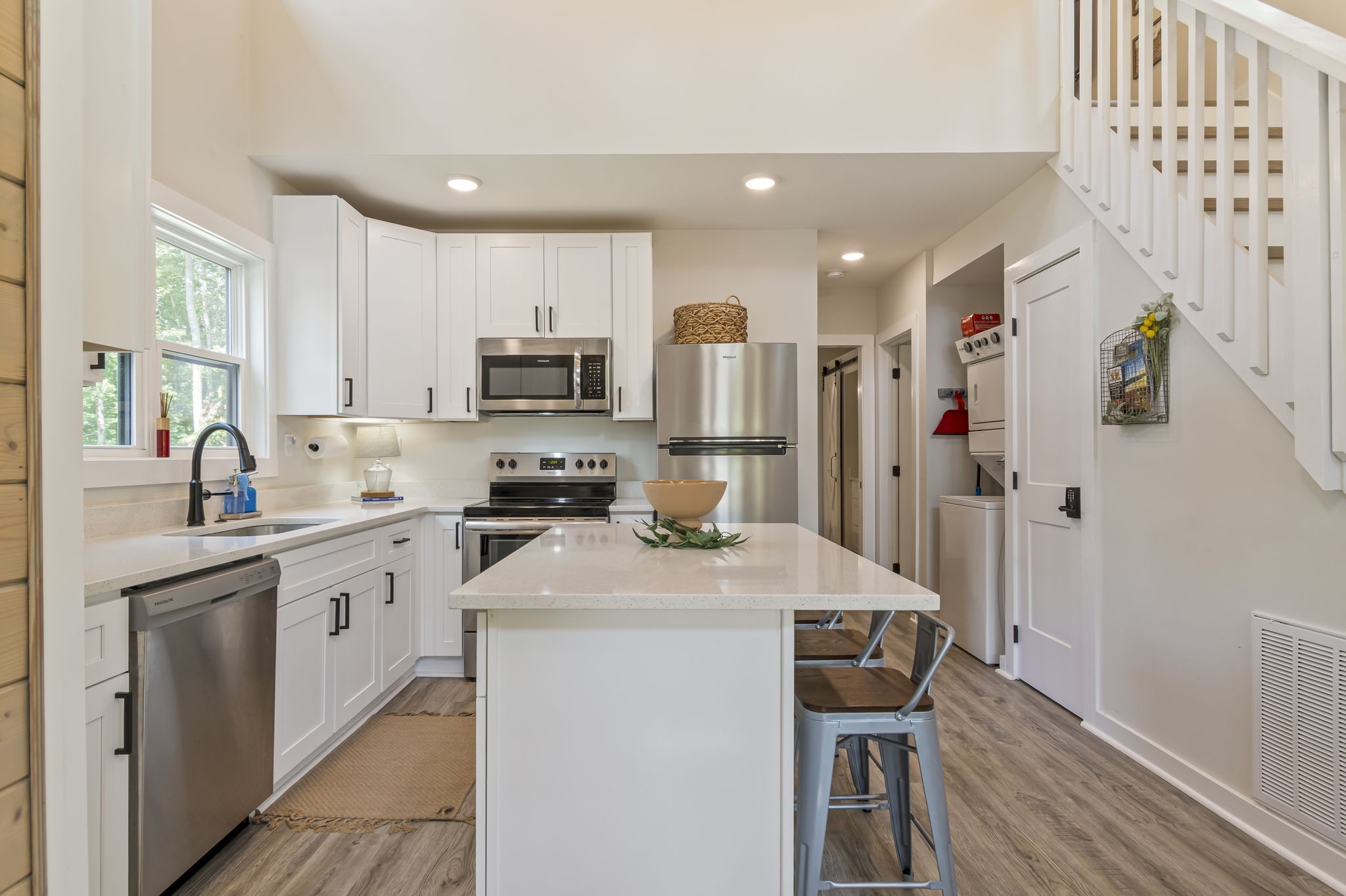 232 Waters Edge Way Tracy City, TN 37387 - Photo 12 of 62 a kitchen with a sink a microwave a refrigerator and cabinets