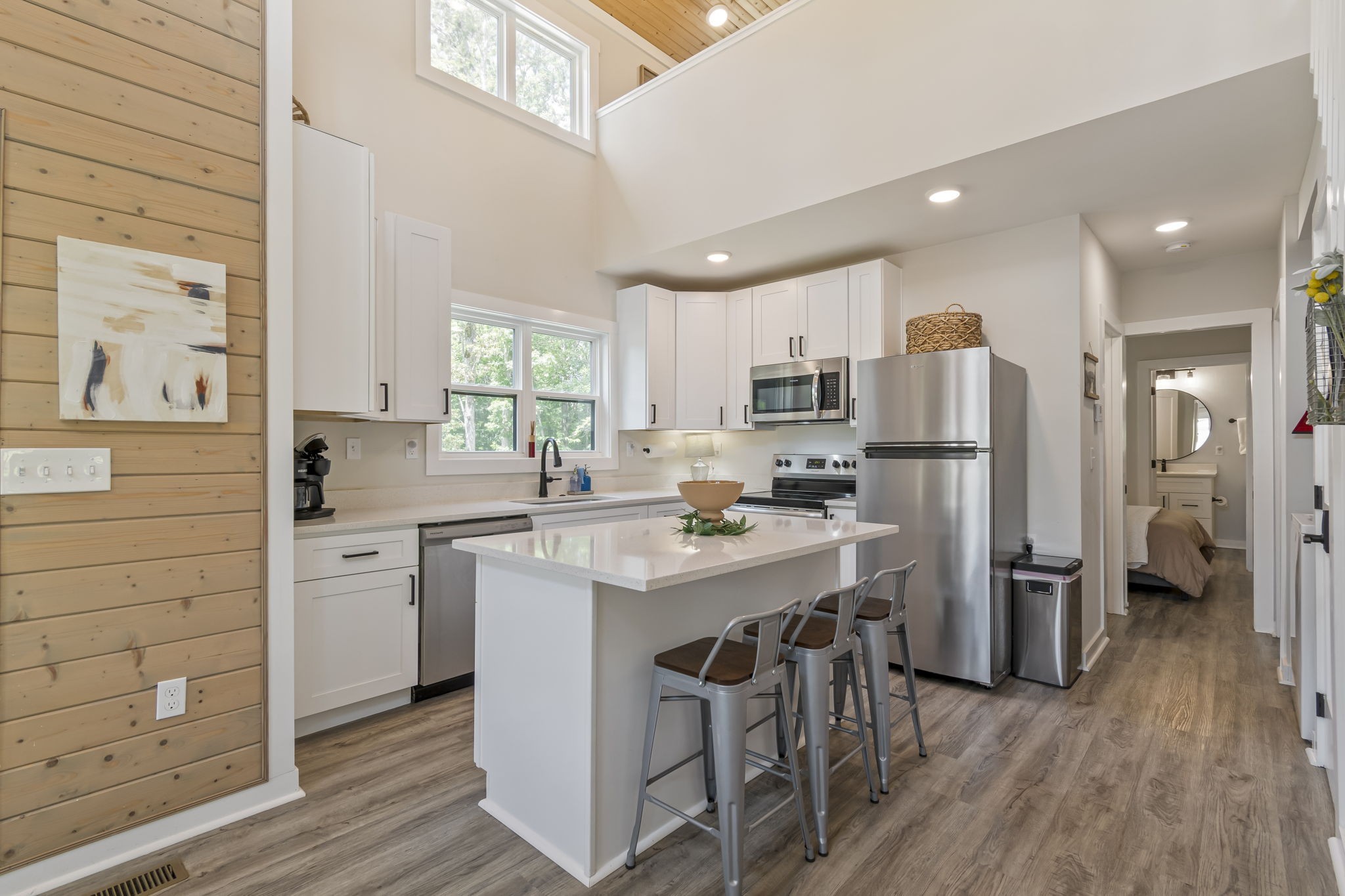232 Waters Edge Way Tracy City, TN 37387 - Photo 13 of 62 a kitchen with refrigerator cabinets and wooden floor