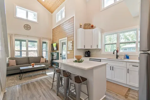 a kitchen with a sink stove and refrigerator