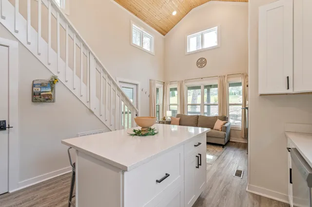 a view of entryway and hall with a front door