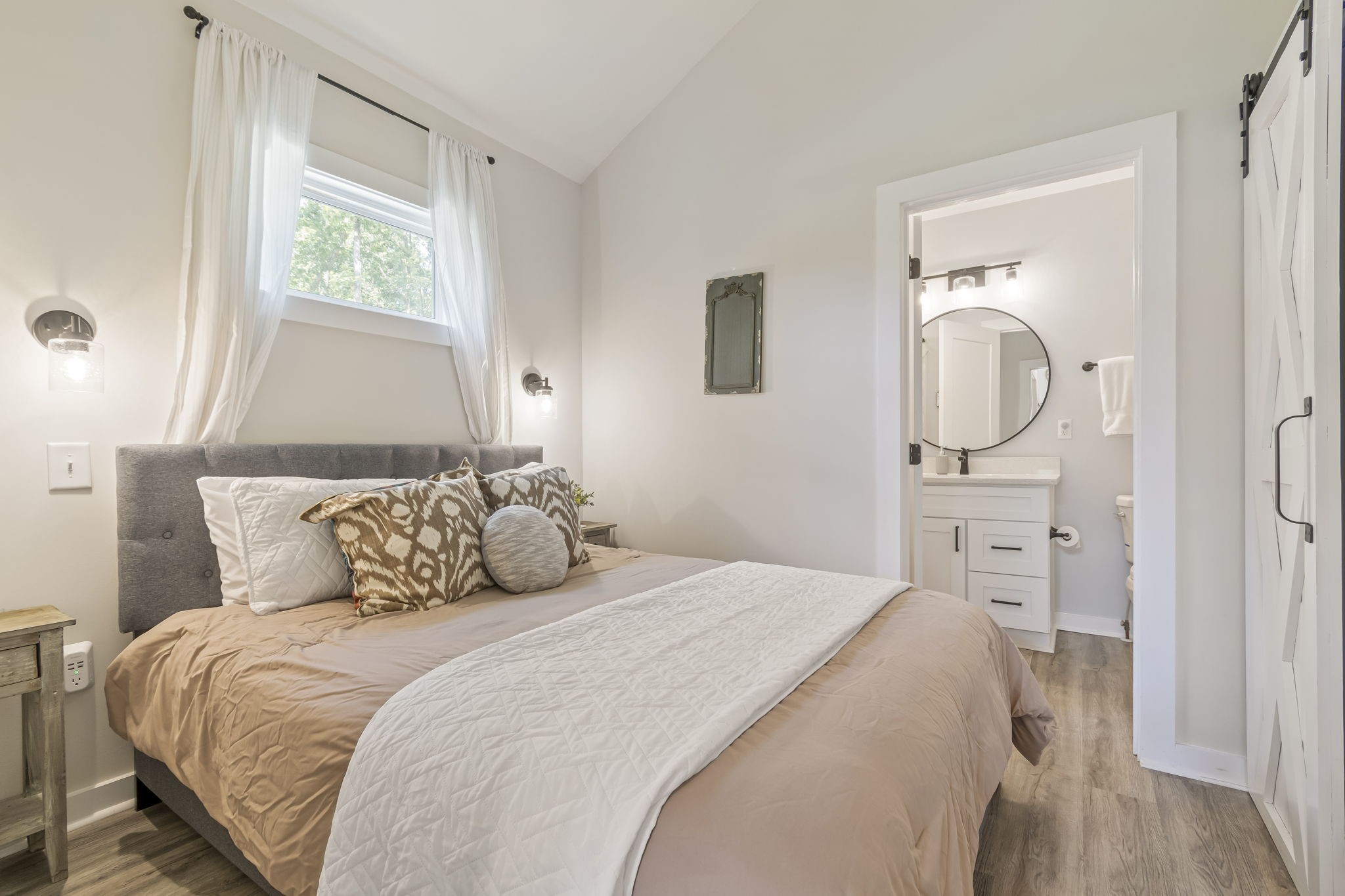 232 Waters Edge Way Tracy City, TN 37387 - Photo 30 of 63 a bedroom with a bed and a mirror