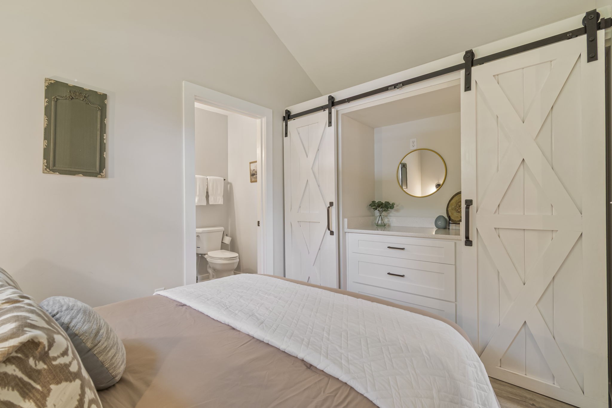 232 Waters Edge Way Tracy City, TN 37387 - Photo 31 of 63 a bedroom with a bed and a mirror