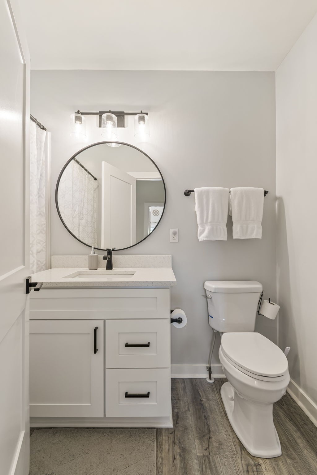 232 Waters Edge Way Tracy City, TN 37387 - Photo 32 of 62 a bathroom with a toilet a sink and a mirror