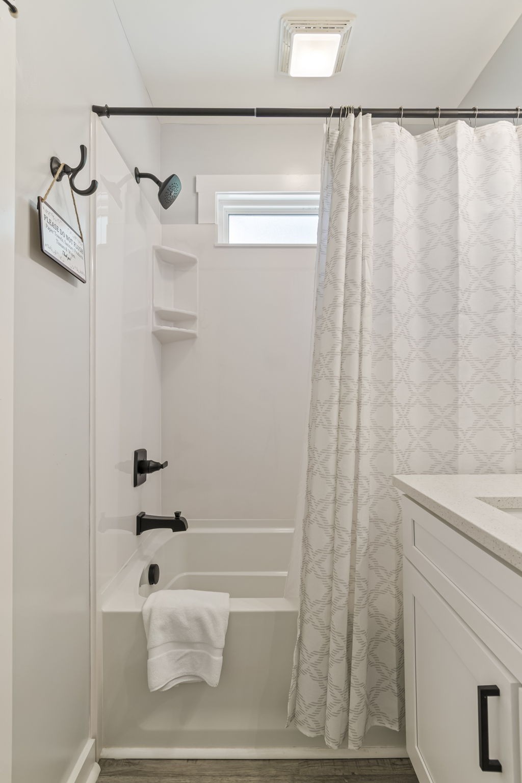 232 Waters Edge Way Tracy City, TN 37387 - Photo 35 of 63 a bathroom with a shower curtain and a sink