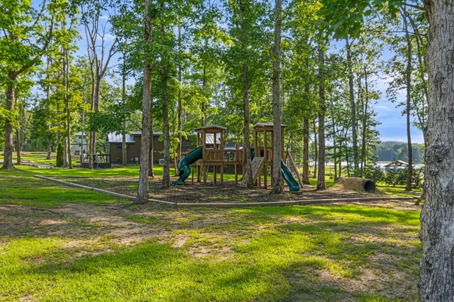 an aerial view of residential house with outdoor space and lake view