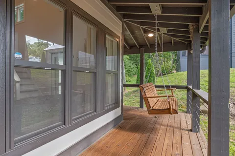 a view of two chairs in the balcony