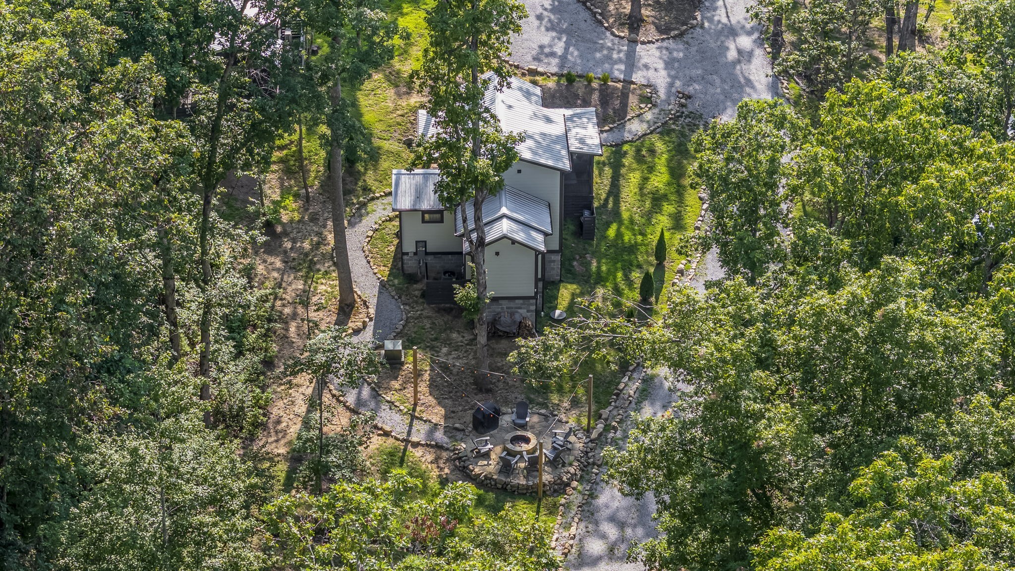 232 Waters Edge Way Tracy City, TN 37387 - Photo 55 of 62 a view of a garden with plants and large trees