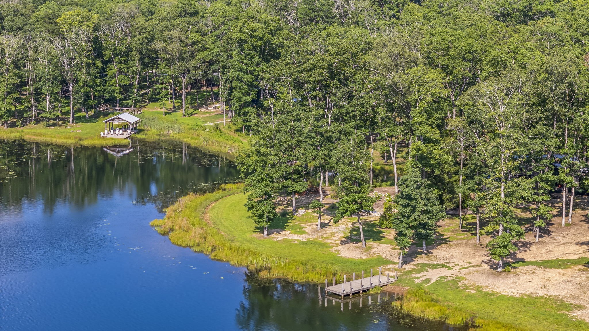 232 Waters Edge Way Tracy City, TN 37387 - Photo 57 of 62 a view of a lake with a house