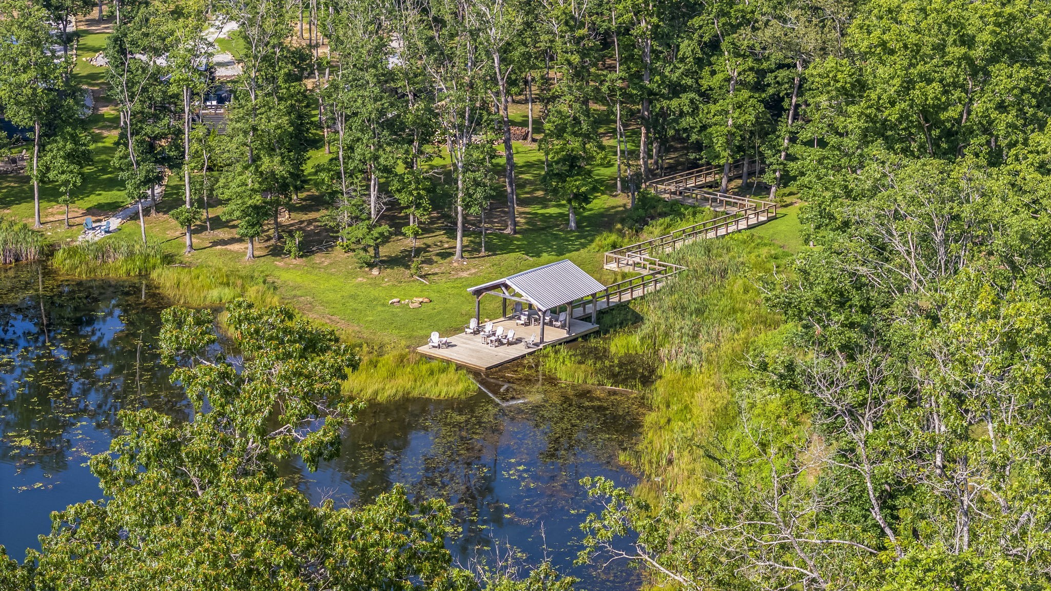 232 Waters Edge Way Tracy City, TN 37387 - Photo 61 of 62 a view of a yard with plants and large trees