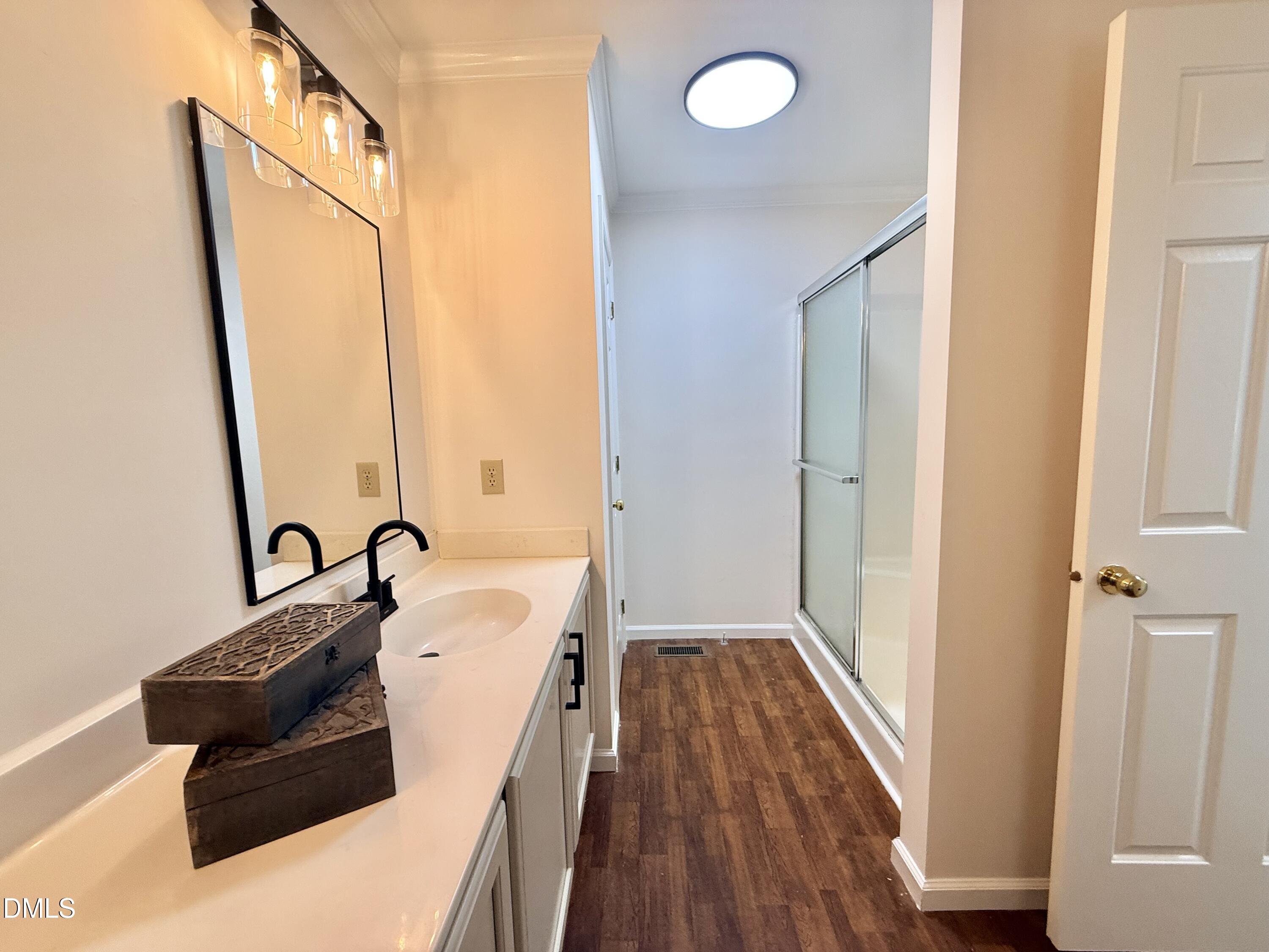 2429 Halifax Road Roxboro, NC 27573 - Photo 32 of 54 a bathroom with a sink and a mirror