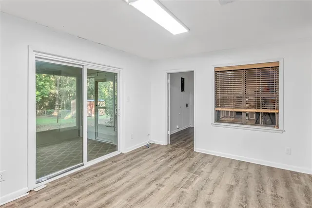 a view of an empty room with glass door