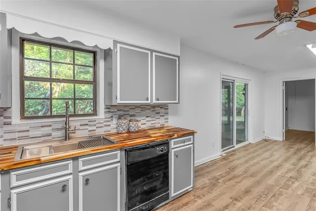 a kitchen that has a sink and a window