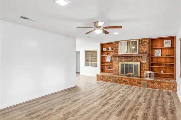 a view of a livingroom with wooden floor