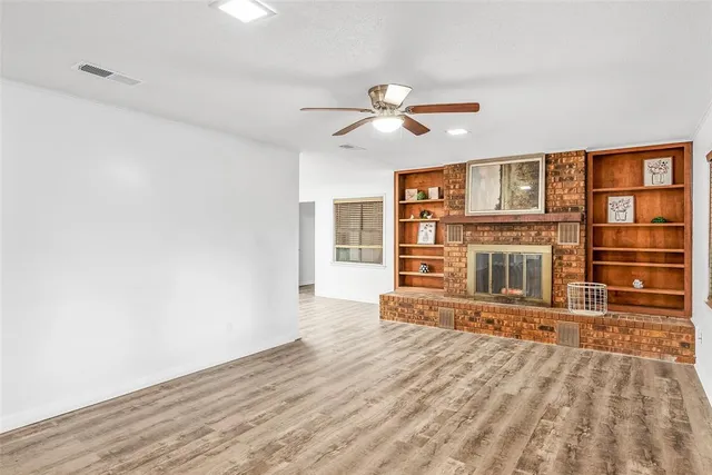 a view of a livingroom with wooden floor