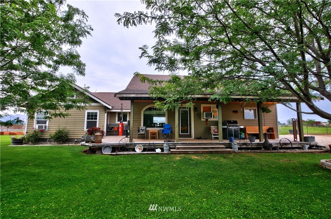 7 Woods Road Omak, WA 98841 - Photo 2 of 39 a view of a house with a backyard and patio