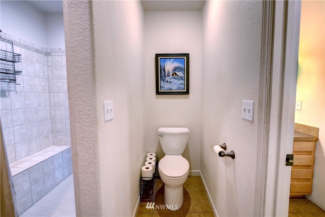 7 Woods Road Omak, WA 98841 - Photo 26 of 39 a bathroom with a toilet and a shower
