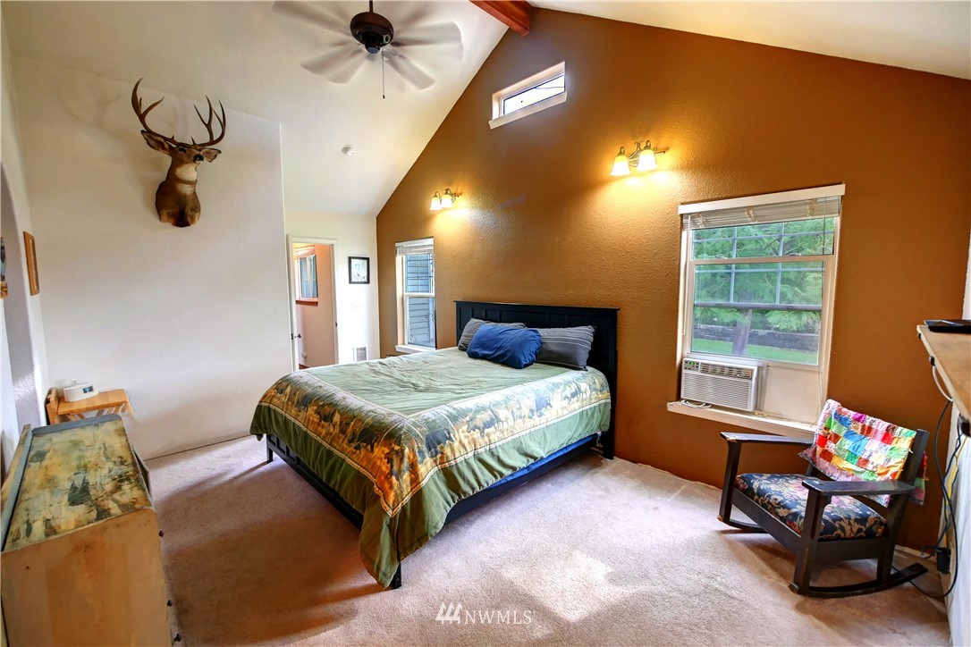 7 Woods Road Omak, WA 98841 - Photo 27 of 39 a bedroom with a bed and a window
