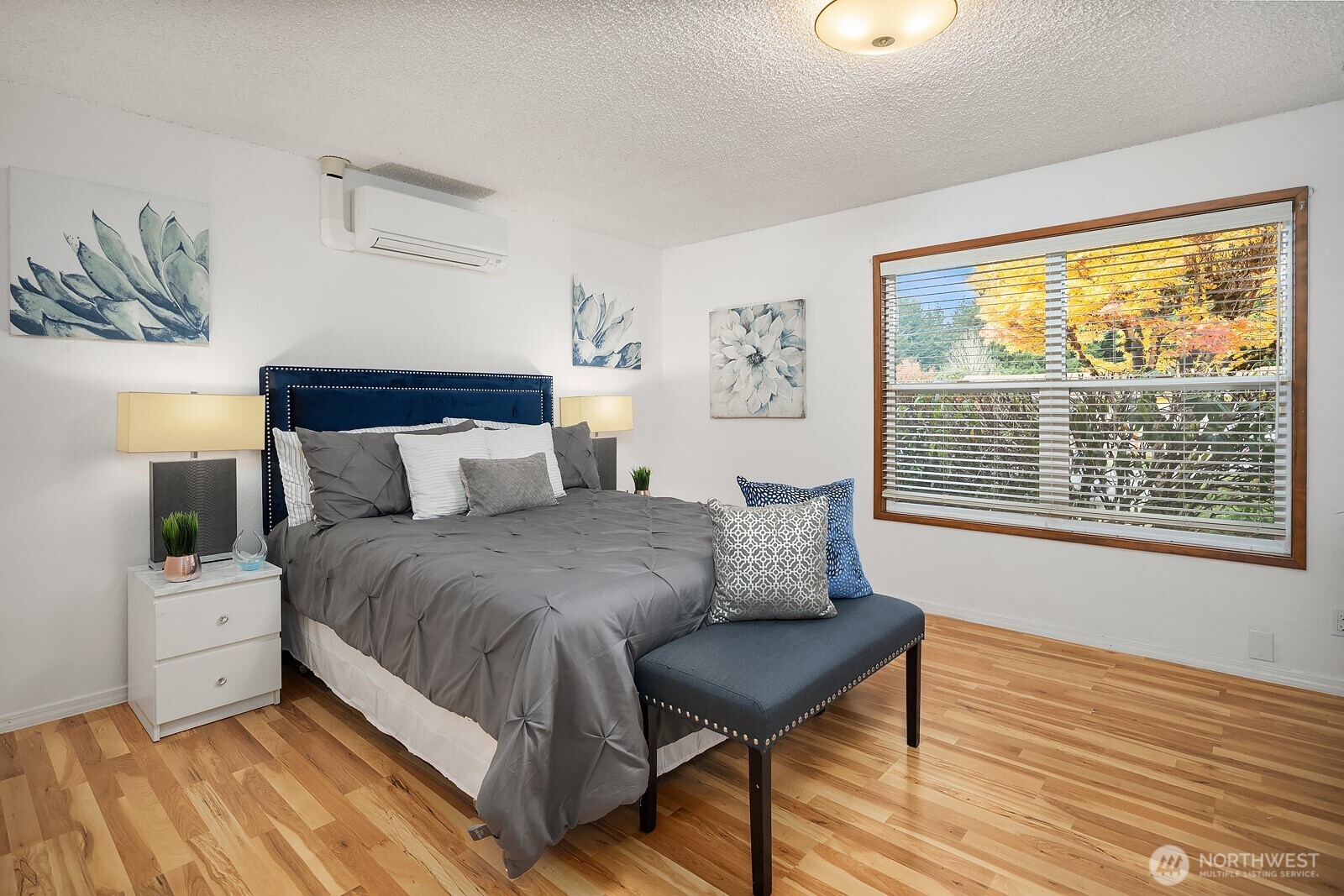 15013 Southeast 113th Street Renton, WA 98059 - Photo 12 of 26 a bedroom with a bed and wooden floor