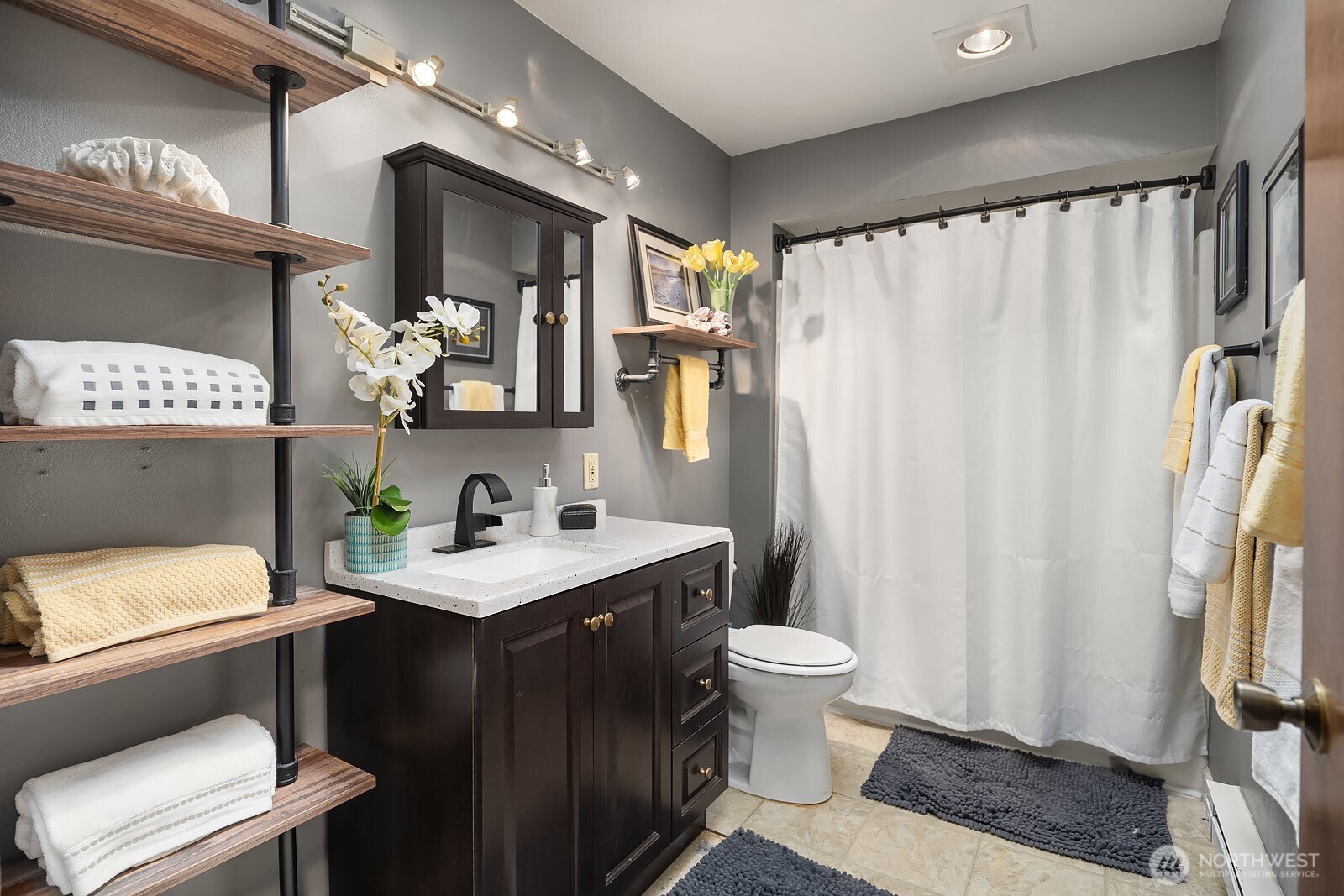 15013 Southeast 113th Street Renton, WA 98059 - Photo 14 of 26 a bathroom with a sink toilet and shower