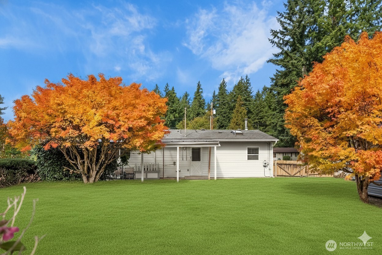 15013 Southeast 113th Street Renton, WA 98059 - Photo 16 of 26 a view of a house with backyard and garden