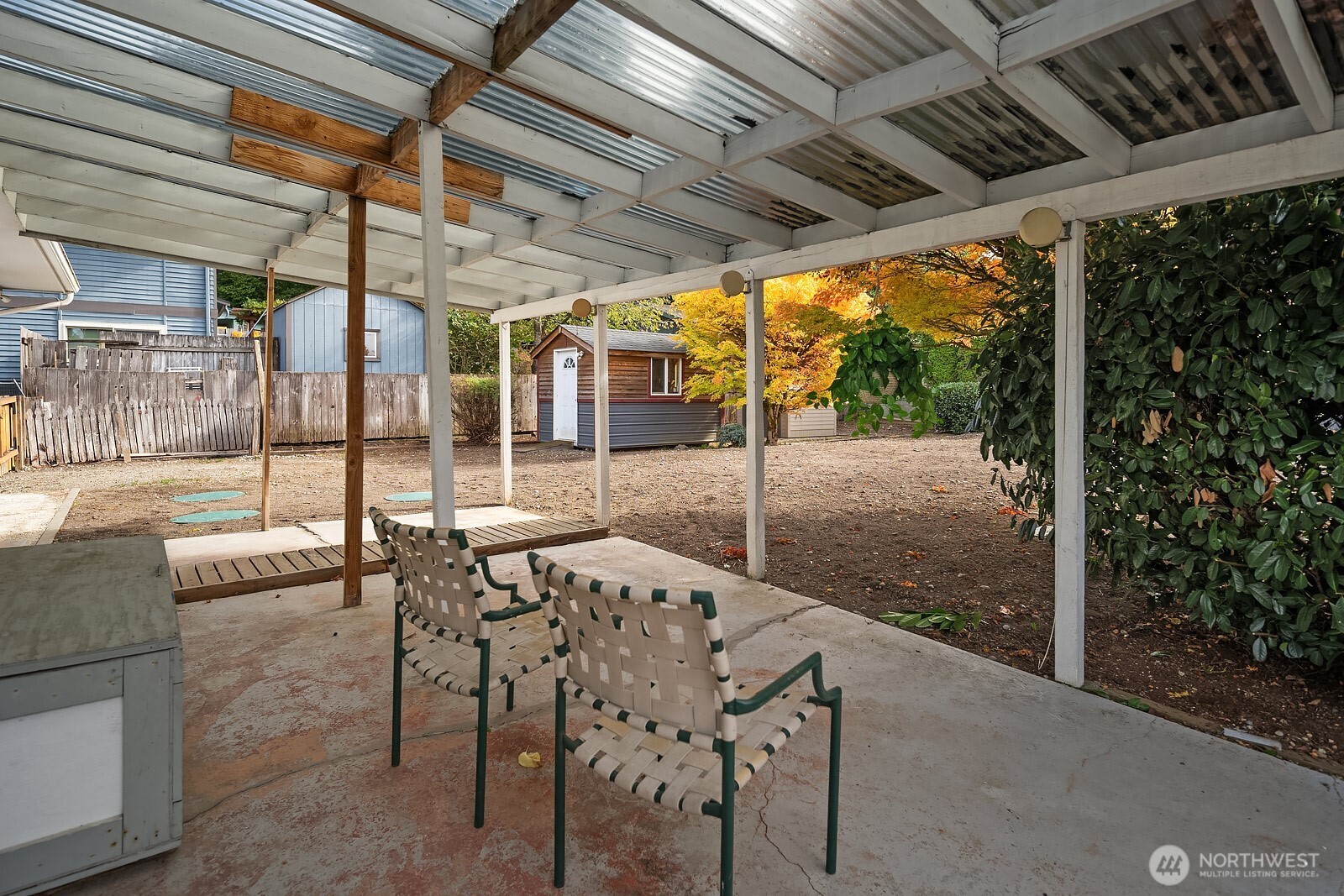 15013 Southeast 113th Street Renton, WA 98059 - Photo 19 of 26 a patio with table and chairs
