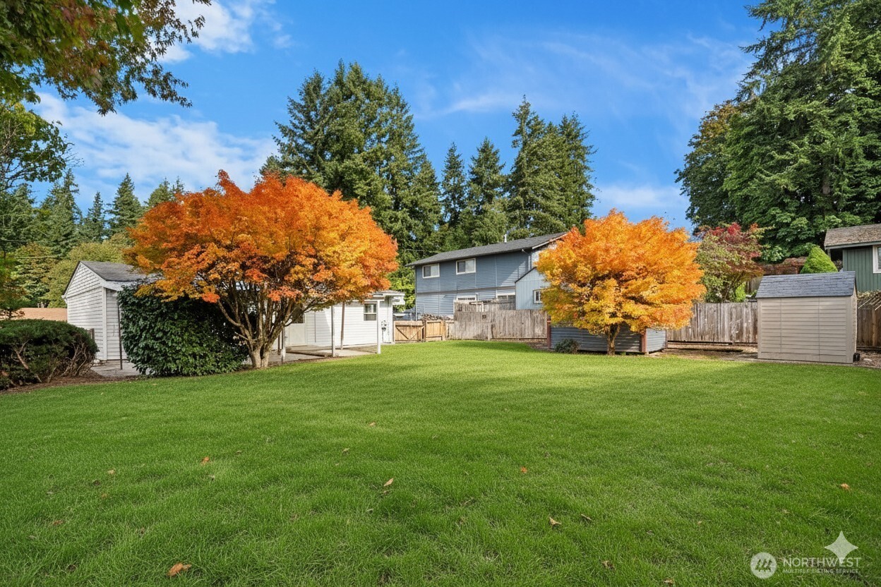 15013 Southeast 113th Street Renton, WA 98059 - Photo 24 of 26 a front view of a house with garden