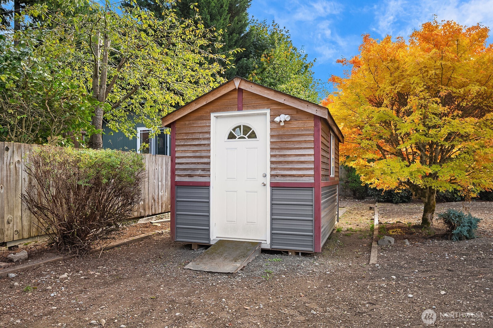 15013 Southeast 113th Street Renton, WA 98059 - Photo 25 of 26 a view of a house with a yard and wooden fence