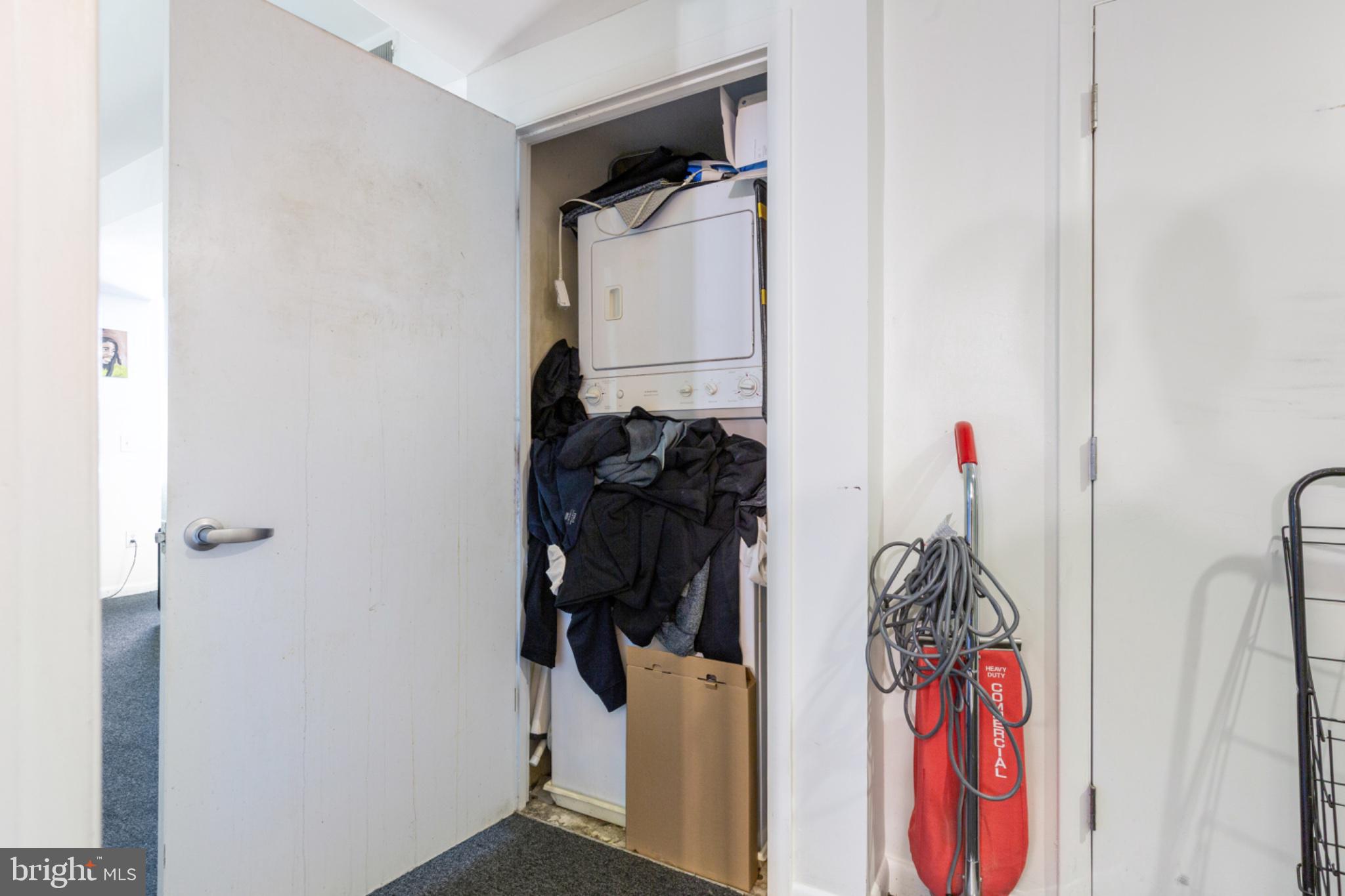 350 G Street Southwest, Unit N423 Washington, DC 20024 - Photo 25 of 43 Laundry nook with hidden chaos.