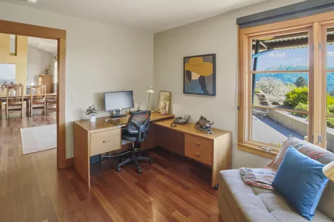 a room with furniture and a wooden floor