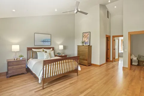 a bedroom with a bed and a table