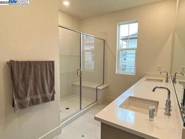 a bathroom with a sink and a shower
