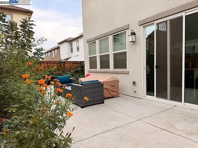 a couple of potted plants in front of door