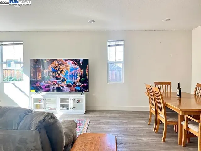 a room with furniture a rug and a window