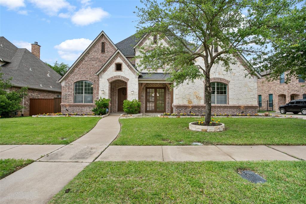 1010 Drake Drive Euless, TX 76039 - Photo 1 of 1 a front view of a house with a yard and garage