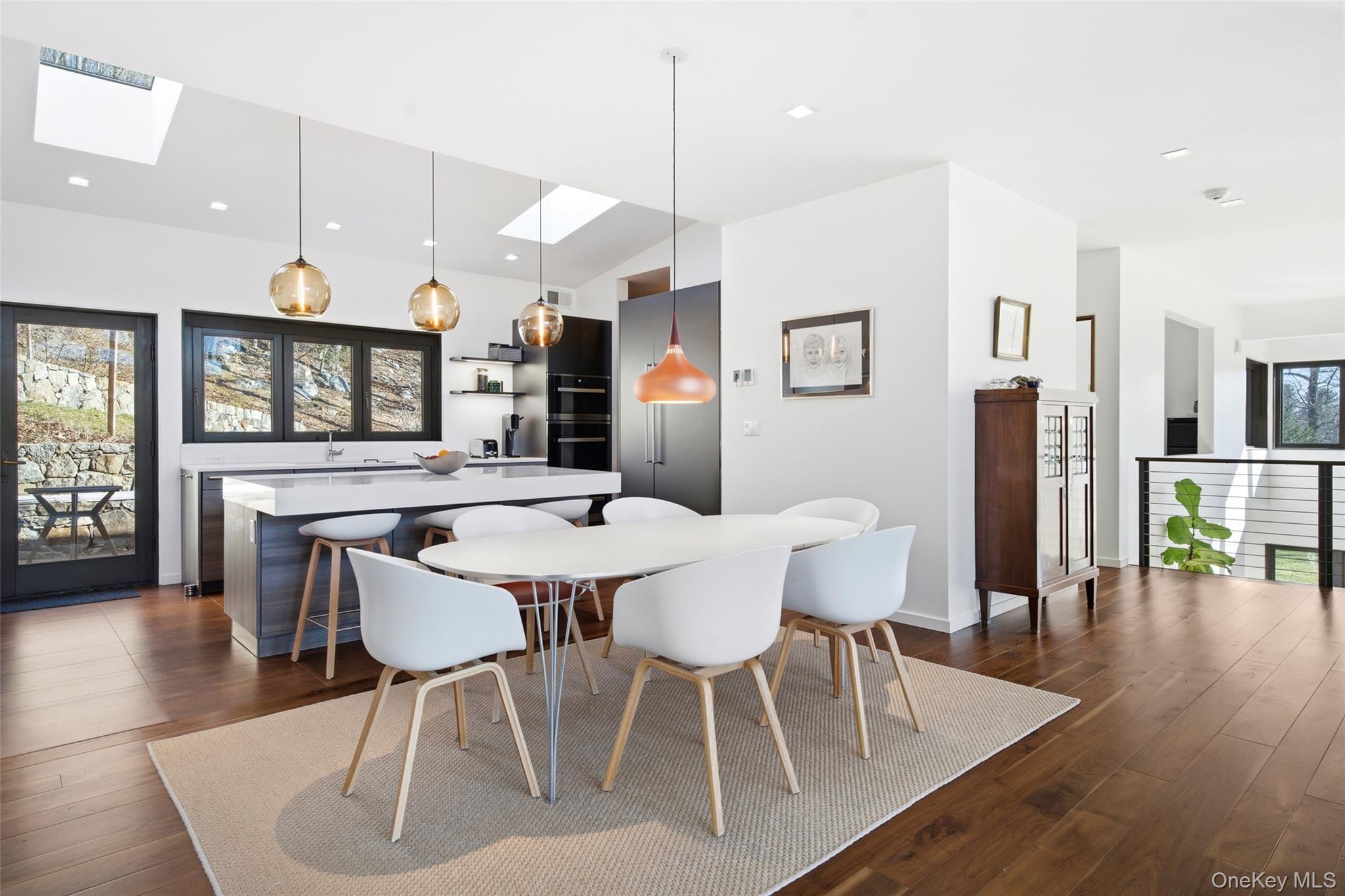2 Lake Ridge Drive Armonk, NY 10504 - Photo 11 of 38 a view of a dining room with furniture and wooden floor