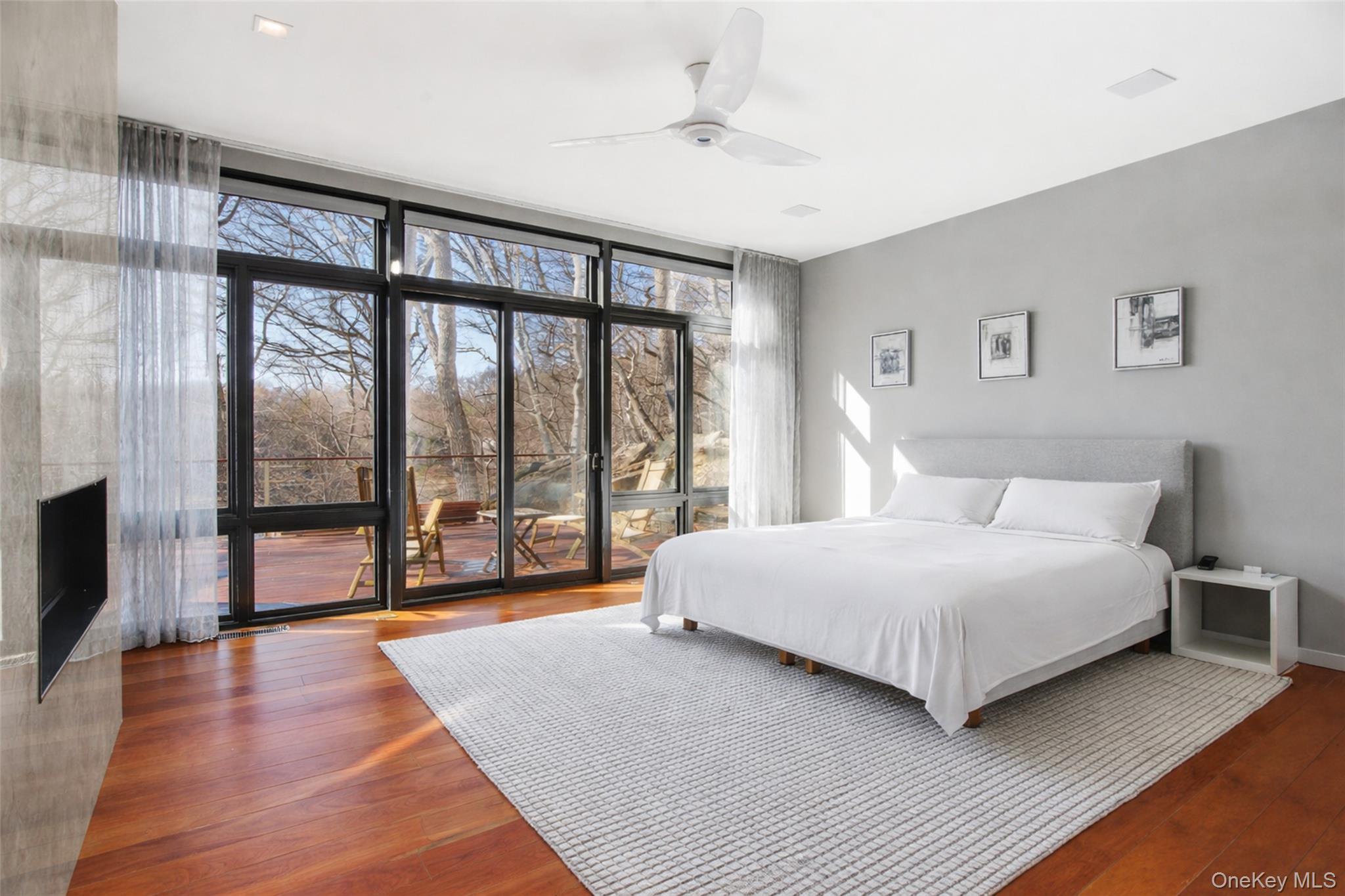 2 Lake Ridge Drive Armonk, NY 10504 - Photo 15 of 38 a spacious bedroom with a large bed and a large window