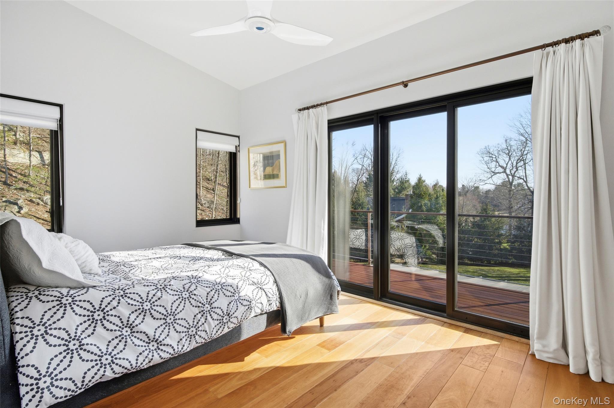 2 Lake Ridge Drive Armonk, NY 10504 - Photo 21 of 38 a bedroom with a large bed and a large window