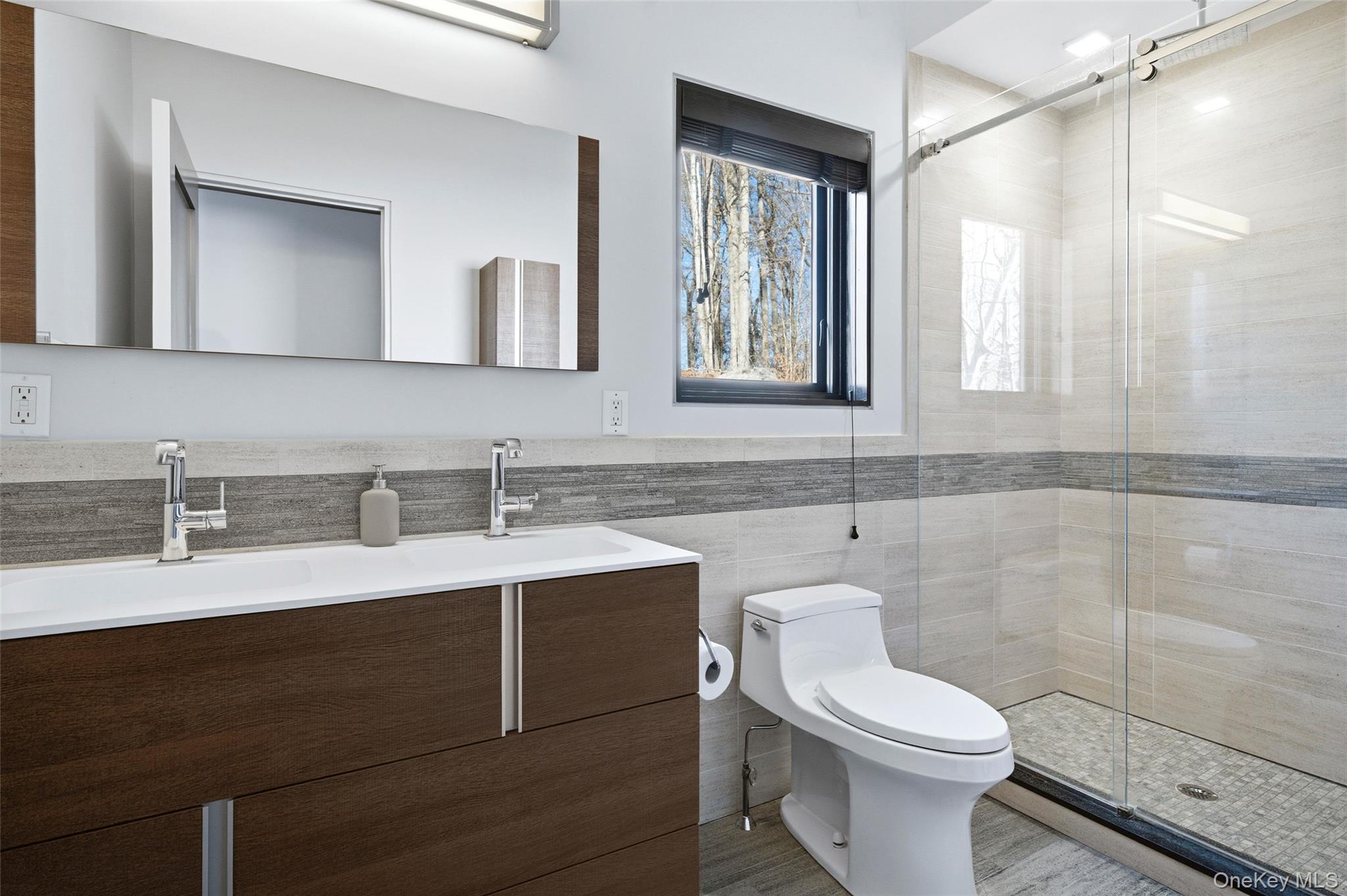 2 Lake Ridge Drive Armonk, NY 10504 - Photo 22 of 38 a bathroom with a toilet a sink a mirror and a shower