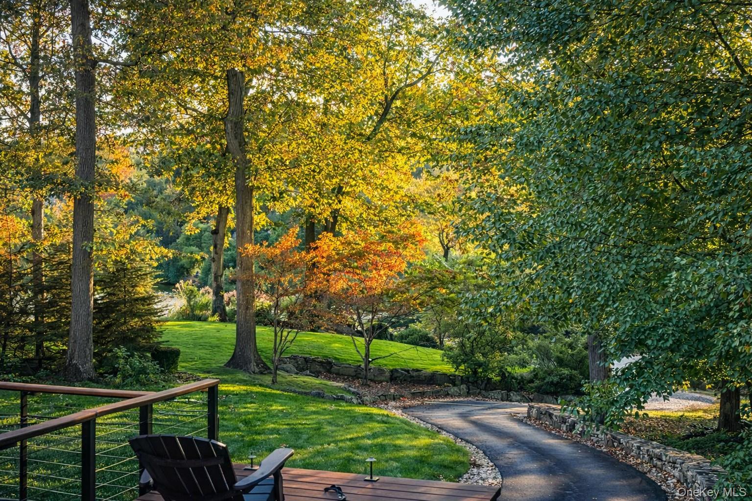 2 Lake Ridge Drive Armonk, NY 10504 - Photo 33 of 38 a view of a street with a wooden fence