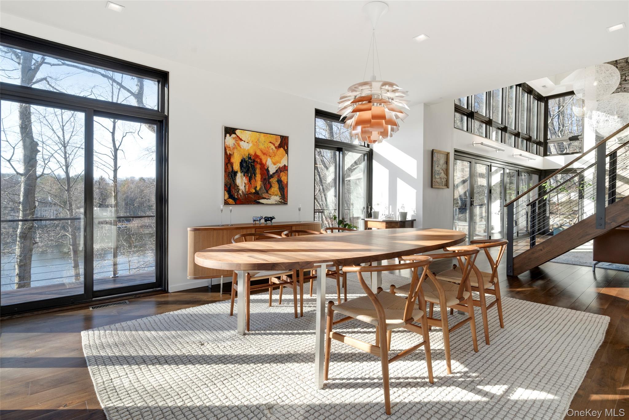 2 Lake Ridge Drive Armonk, NY 10504 - Photo 6 of 38 a view of a livingroom with furniture and a floor to ceiling window