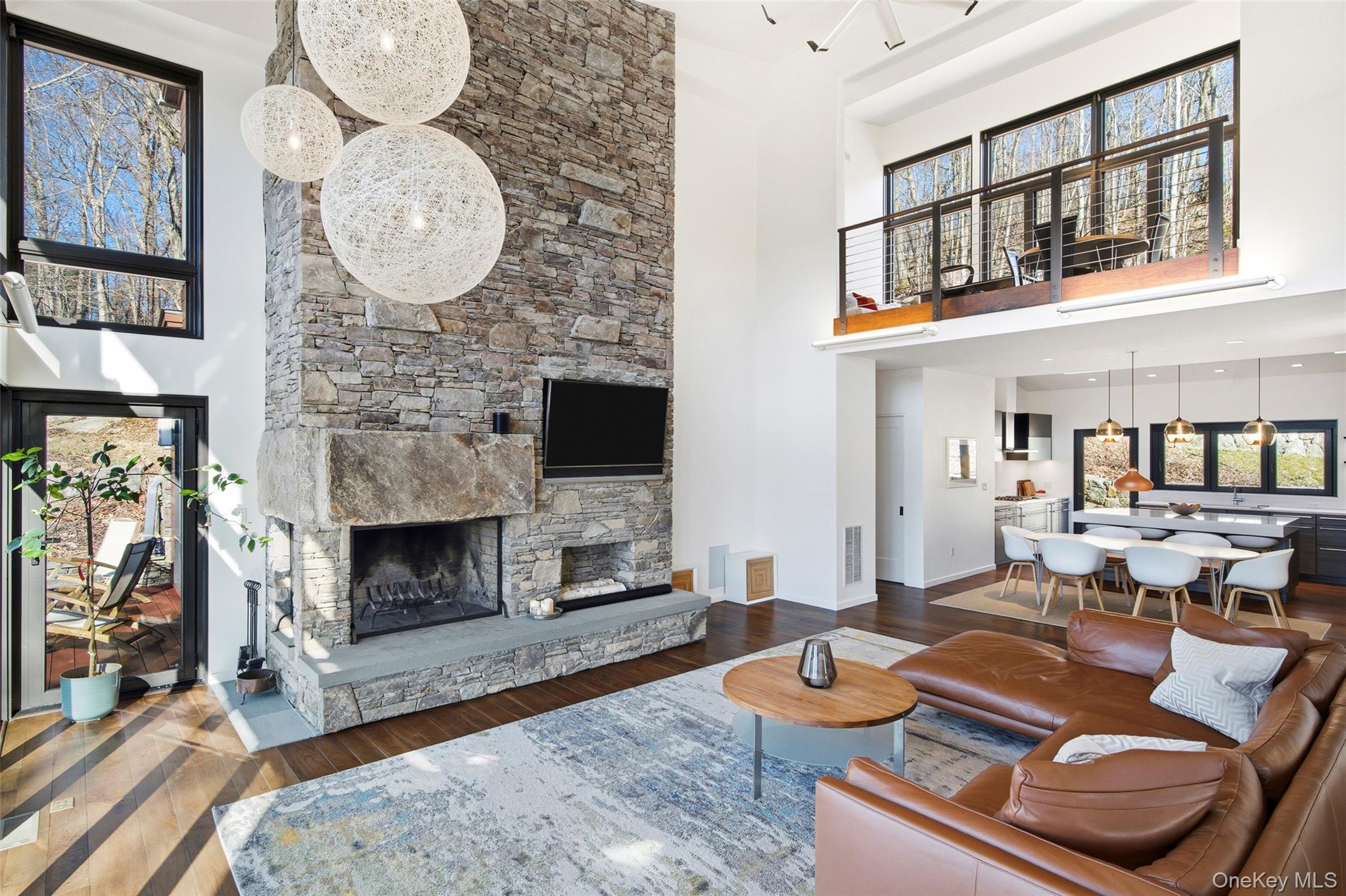 2 Lake Ridge Drive Armonk, NY 10504 - Photo 9 of 38 a living room with furniture a fireplace and a large mirror