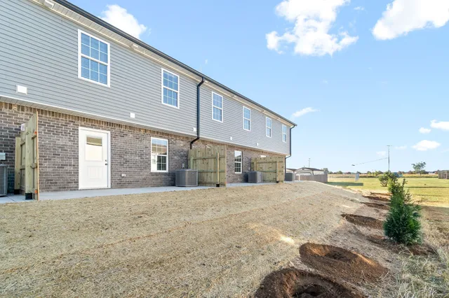 a view of an ocean & house with swimming pool